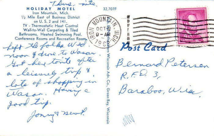 Holiday Motel (Econo Lodge Inn & Suites) - Vintage Postcard Back (newer photo)